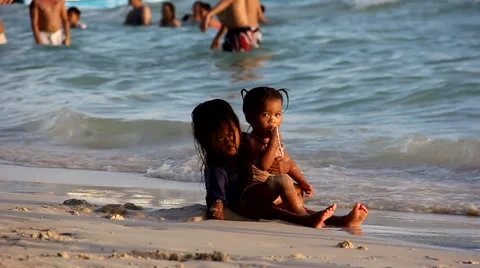 Kids are playing on the beach Video stock 64053833