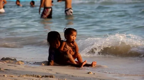 Kids are playing on the beach Video stock 64053844