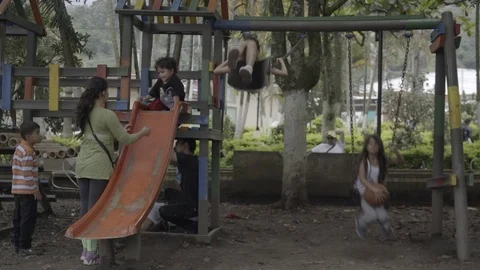 Kids are playing with swing in the garden Stock Footage