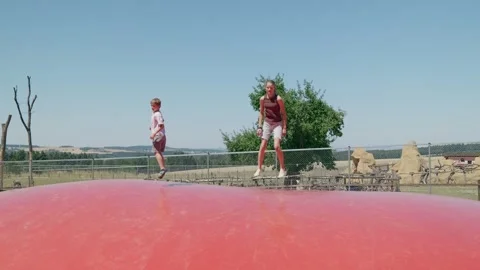 Kids Are Playing on the Trampoline Stock-Footage 345596124