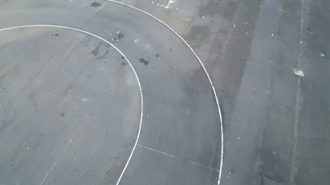 Kids are practicing roller skates with coach on the small circuits. 4k Stock Footage 247347704