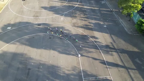 Kids are practicing roller skates with coach on the small circuits. 4k Stock Footage 247347952