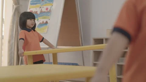 Kids are preparing desk for studying at kindergarten Stock Footage 134227763