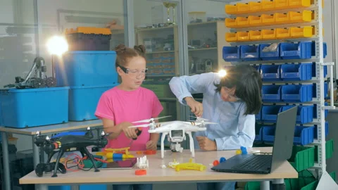 Kids assembling aircraft in technology class. Stock Footage 93591358