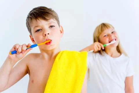 Kids brushing teeth Stock Photos