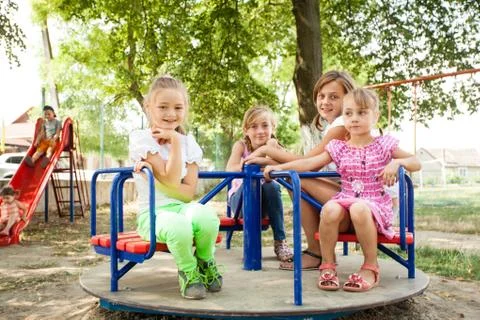 Kids on the carousel Stock Photos