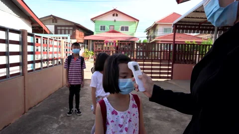 Kids checking body temperature by infrared thermometer for protect and safety 库存影片 132587771