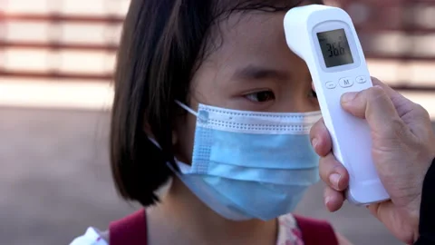 Kids checking body temperature by infrared thermometer for protect and safety 動画素材 132589118