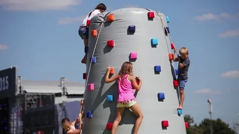 Kids climb on climbing wall Stock Footage 80894713