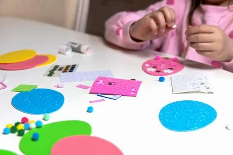 Kids creative easter craft making diy paper egg decorations. Stock Photos