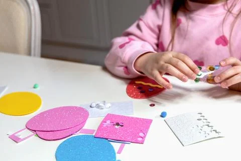 Kids creative easter craft making diy paper egg decorations. Stock Photos