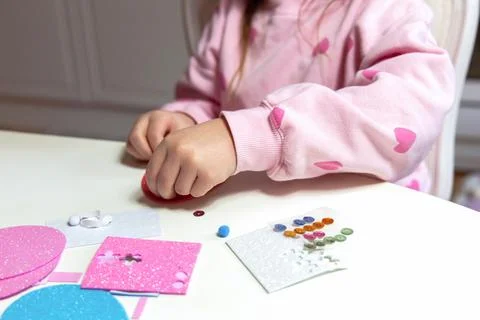 Kids creative easter craft making diy paper egg decorations. Stock Photos