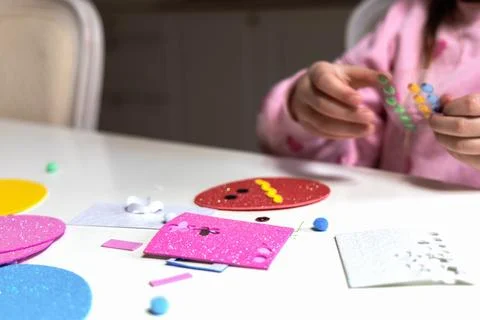 Kids creative easter craft making diy paper egg decorations. Stock Photos