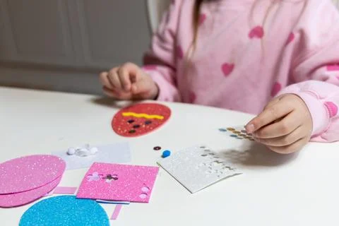 Kids creative easter craft making diy paper egg decorations. Stock Photos