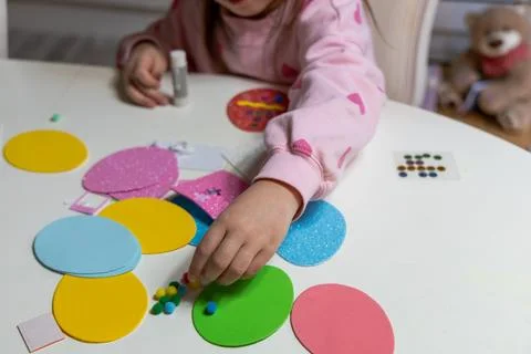 Kids creative easter craft making diy paper egg decorations. Stock Photos