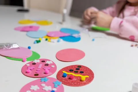 Kids creative easter craft making diy paper egg decorations. Stock Photos
