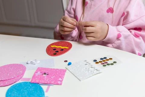 Kids creative easter craft making diy paper egg decorations. Stock Photos