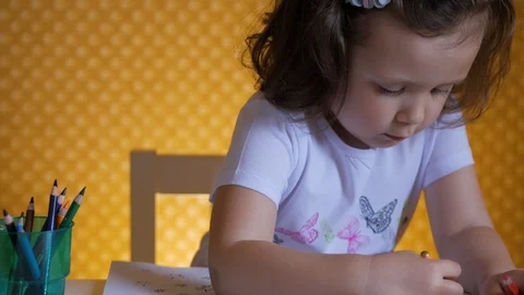 Kid's creativity. The child draws with colored pencils. Stock Footage 110802960