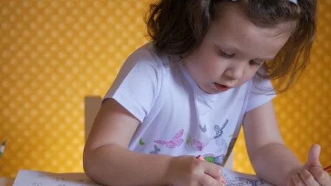 Kid's creativity. The child draws with colored pencils. Stock Footage 112666212