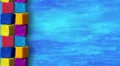 Kids cubes on blue background, loop, stop motion. HD Footage