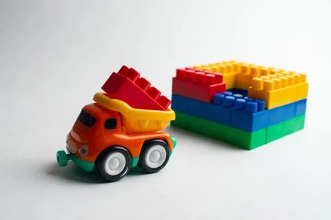Kids development, Building blocks, Building construction and lorry Stock Photos