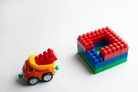 Kids development, Building blocks, Building construction and lorry Stock Photos
