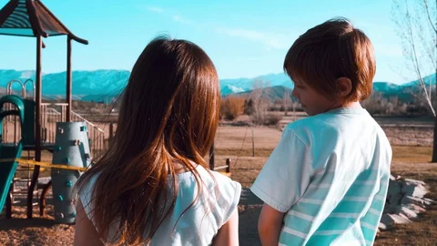 Kids Disappointed While Looking At A Closed Playground Stock Footage 129440443