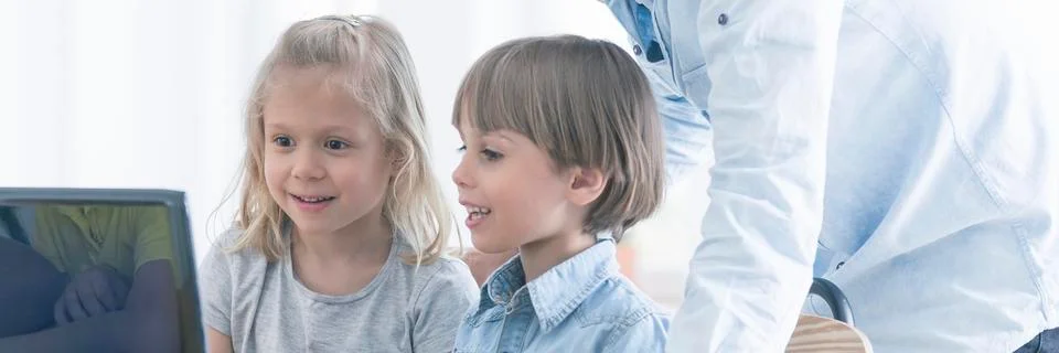 Kids discovering coding possibilities Stock Photos