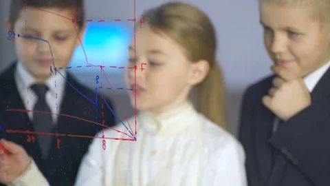 Kids discuss the graph at the virtual screen. Business science with children  Vídeo Stock 71952997