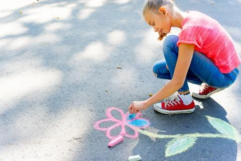 Kids drawing with chalk Stock Photos