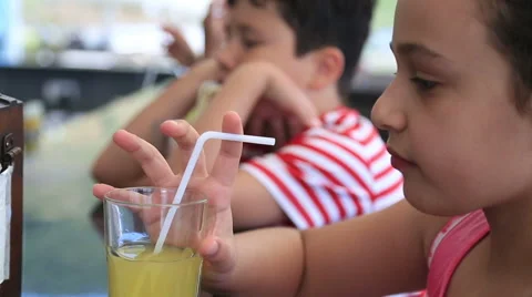 Kids drinking lemonade at the restaurant 2 Stock-Footage 63324714
