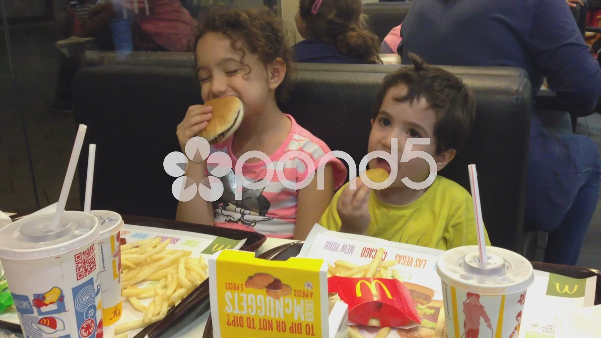 Kids eat happy meals in McDonald's Stock Video Pond5