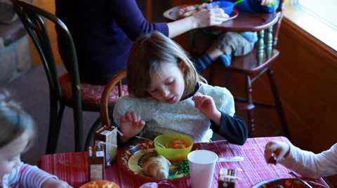 Kids eating macaroni dinner Stock Footage 32907342