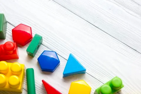Kids educational developing toys frame on white background. Top view. Flat lay Stock Photos
