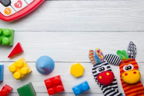 Kids educational developing toys frame on white background. Top view. Flat lay Stock Photos