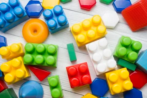 Kids educational developing toys frame on white background. Top view. Flat lay Stock Photos