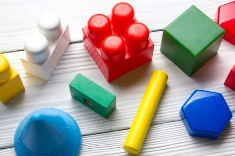Kids educational developing toys frame on white background. Top view. Flat lay Foto stock