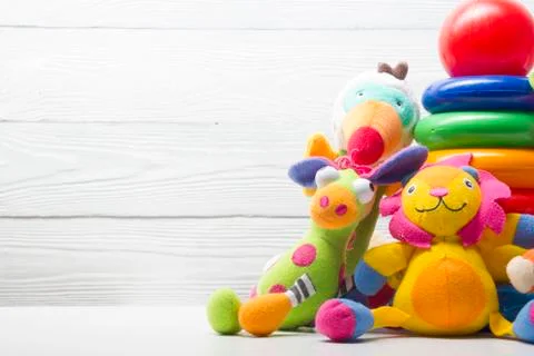 Kids educational developing toys frame on white background. Top view. Flat lay Stock Photos
