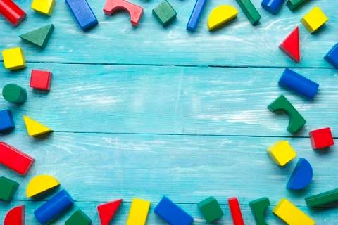Kids educational developing toys frame on white background. Top view. Flat lay Photos