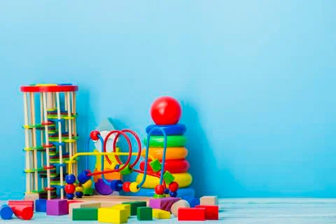 Kids educational developing toys frame on white background. Top view. Flat lay Photos