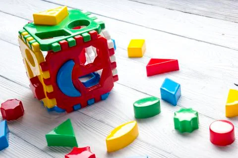 Kids educational developing toys frame on white background. Top view. Flat lay Foto stock