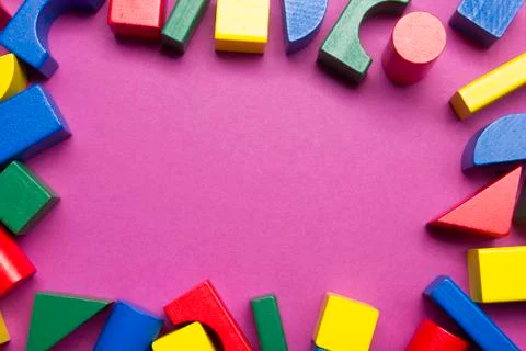 Kids educational developing toys frame on white background. Top view. Flat lay Photos