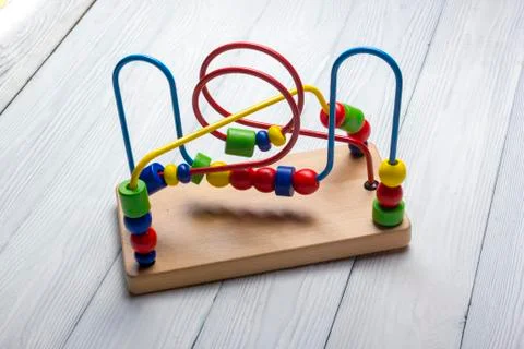 Kids educational developing toys frame on white background. Top view. Flat lay Stock Photos