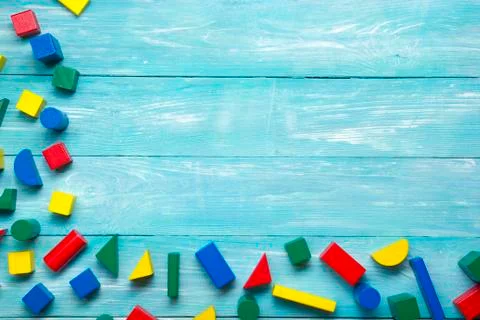 Kids educational developing toys frame on white background. Top view. Flat lay Stock Photos