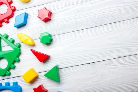 Kids educational developing toys frame on white background. Top view. Flat lay Stock Photos
