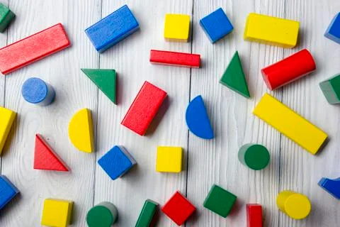 Kids educational developing toys frame on white background. Top view. Flat lay Stock Photos