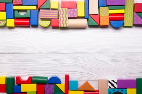 Kids educational developing toys frame on white background. Top view. Flat lay Stockfoto's