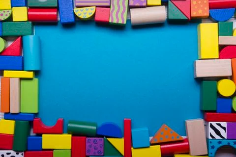 Kids educational developing toys frame on white background. Top view. Flat lay Stock Photos
