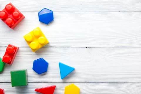 Kids educational developing toys frame on white background. Top view. Flat lay Stock Photos