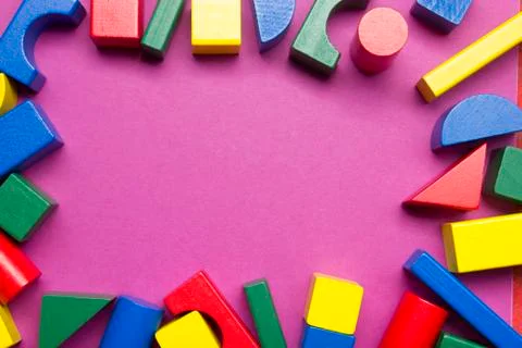 Kids educational developing toys frame on white background. Top view. Flat lay Stock Photos